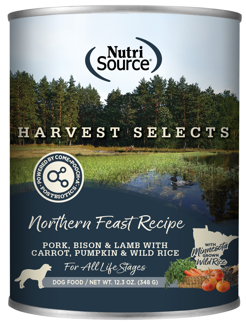 A can of NutriSource Harvest Selects Northern Feast dog food with an image of a scenic background featuring a duck in a lake with wild rice growing.