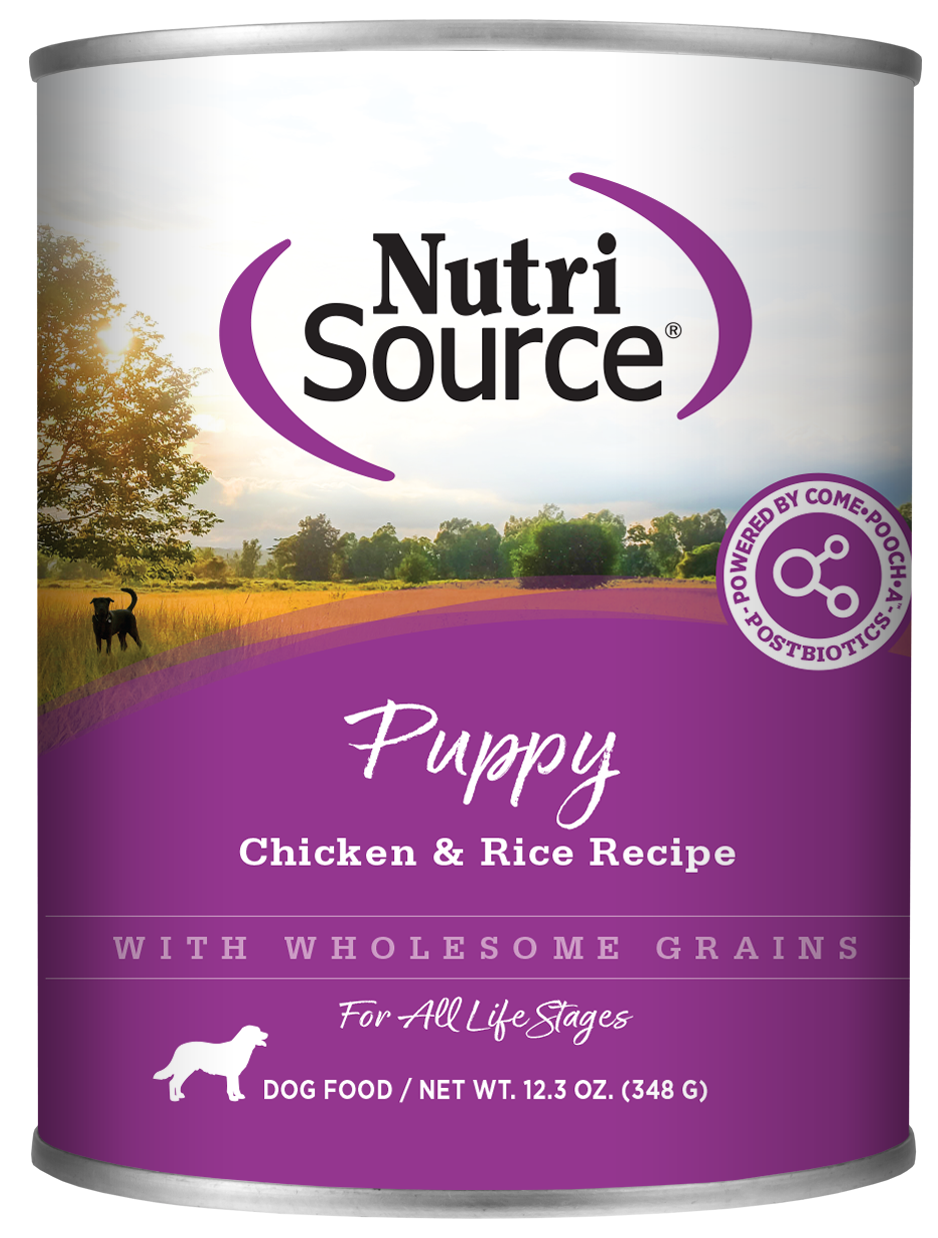A can of NutriSource Chicken & Rice Puppy Dog Food with a background depicting a dog in a field.