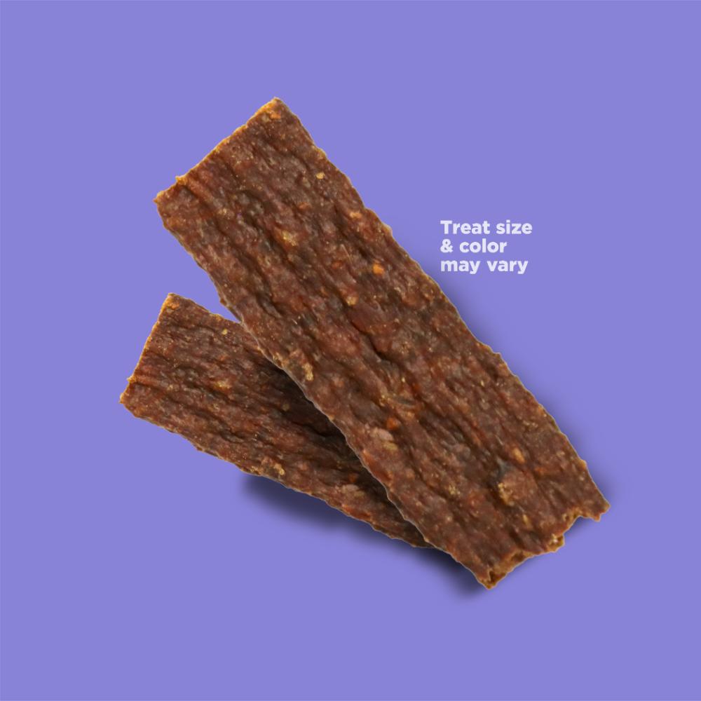 Photo of two Jivin' Jerky strips with text that reads "Treat size & color may vary"