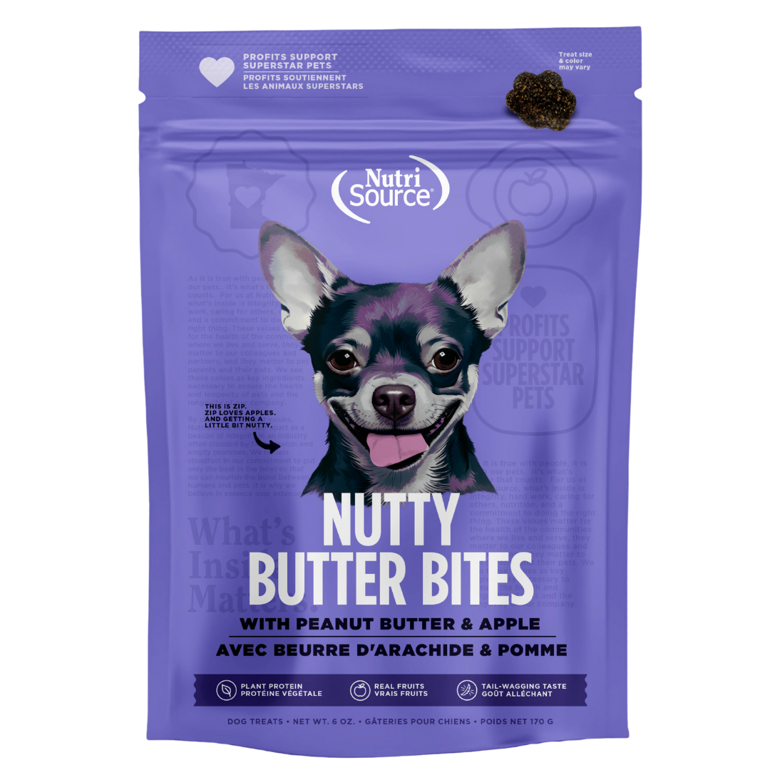 A package of NutriSource Peanut Butter & Apple Nutty Butter Bites dog treats with an image of a dog on the front.